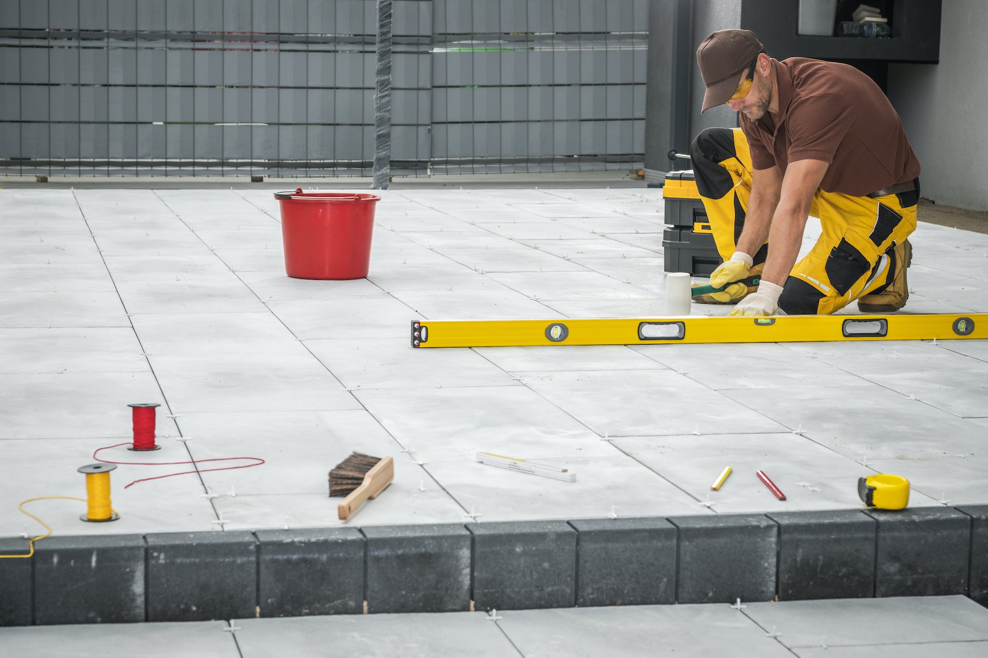 Outdoor Patio Tiles Installation by Professional Worker