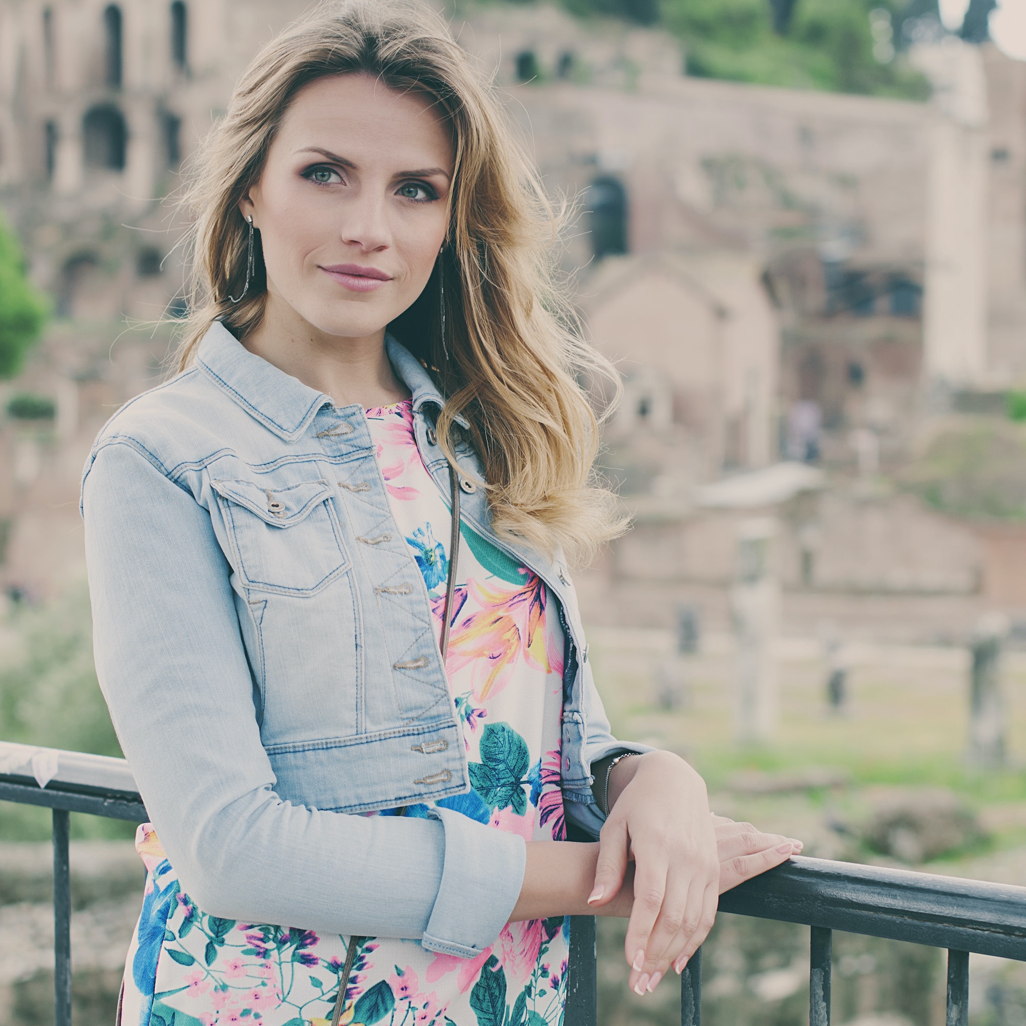 Pretty female tourist on the ruins of the Roman Forum in Rome, Italy