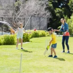 Family playing cricket together